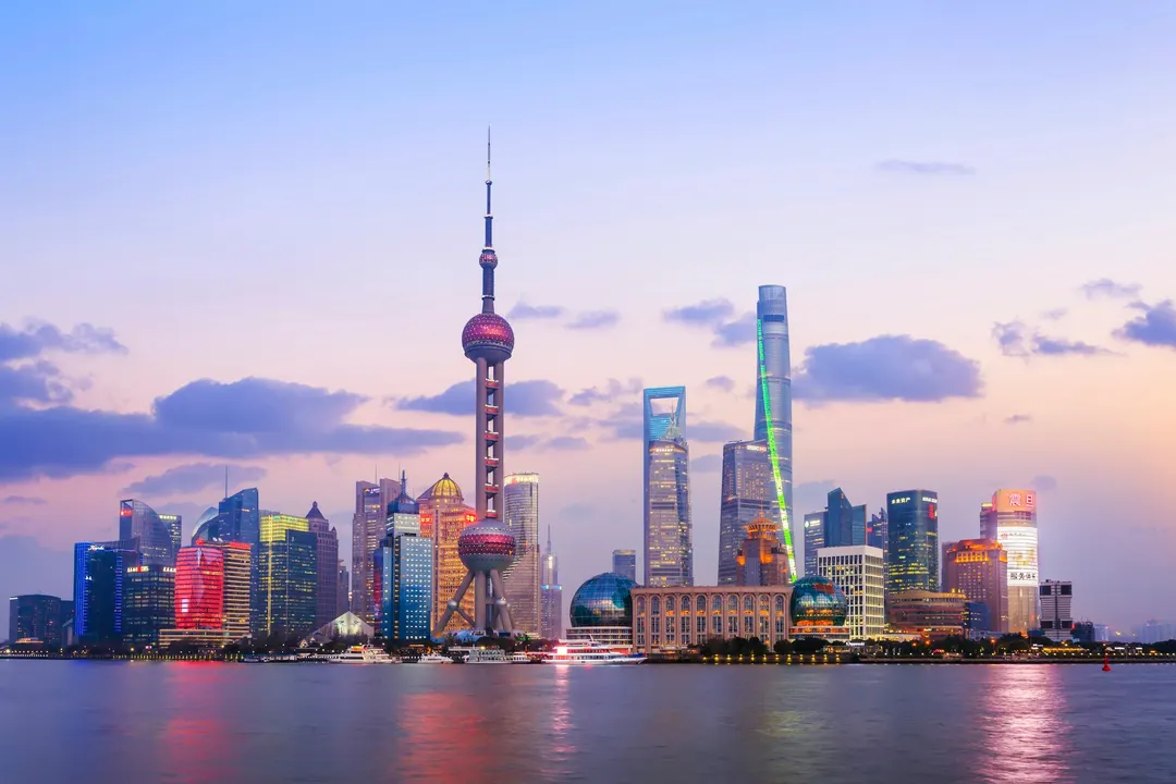 The Lujiazui skyline across the Huangpu River at dusk, seen from the Bund in Shanghai