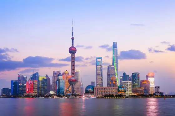The Lujiazui skyline across the Huangpu River at dusk, seen from the Bund in Shanghai