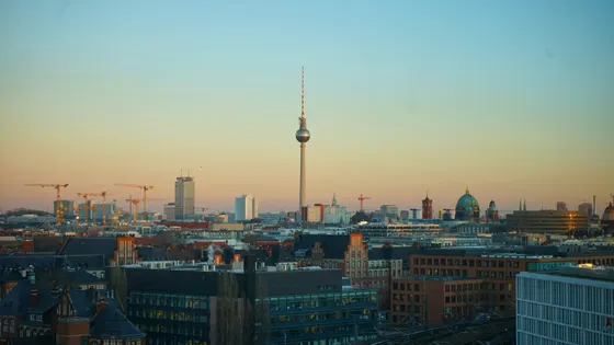 The Berlin skyline at dusk with the Fernsehturm and the Berlin Cathedral dome
