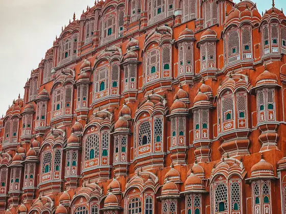 The pink sandstone facade of the Hawa Mahal in Jaipur, India