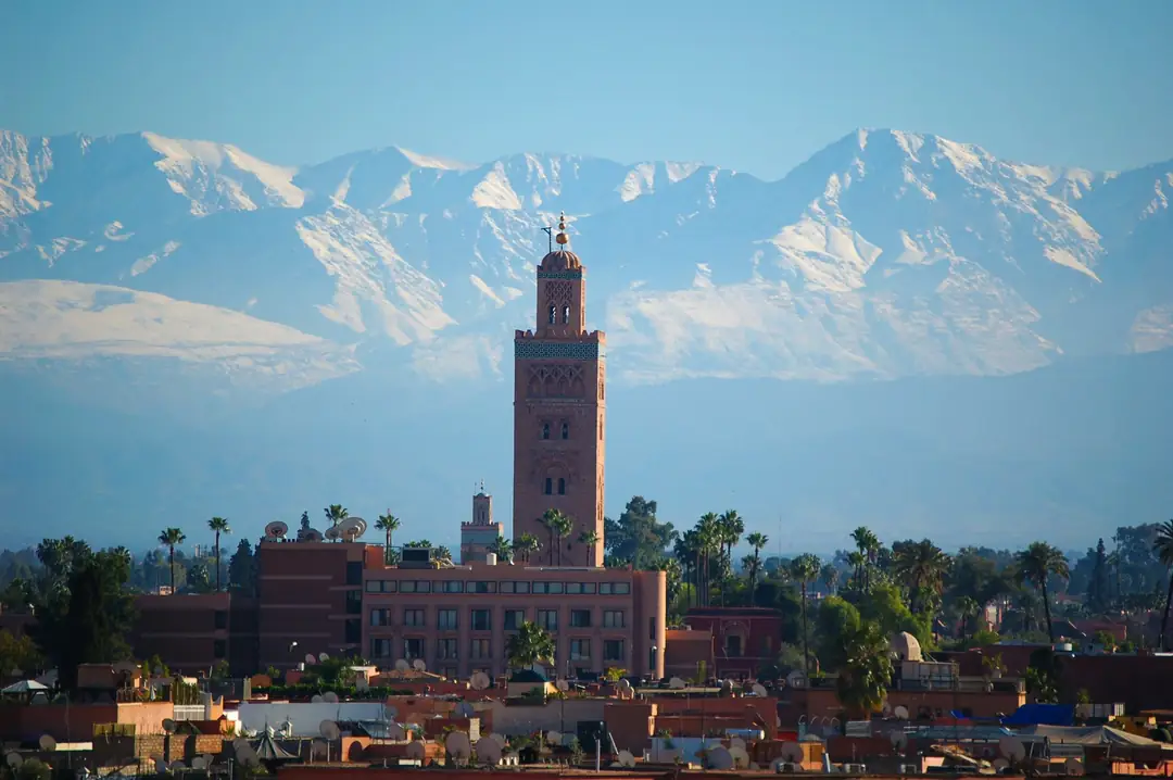 The minaret of the Koutoubia Mosque in Marrakesh against a blue sky