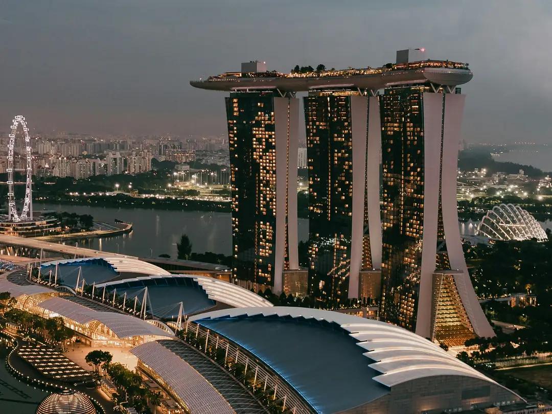 Marina Bay Sands and the Singapore Flyer lit up at dusk